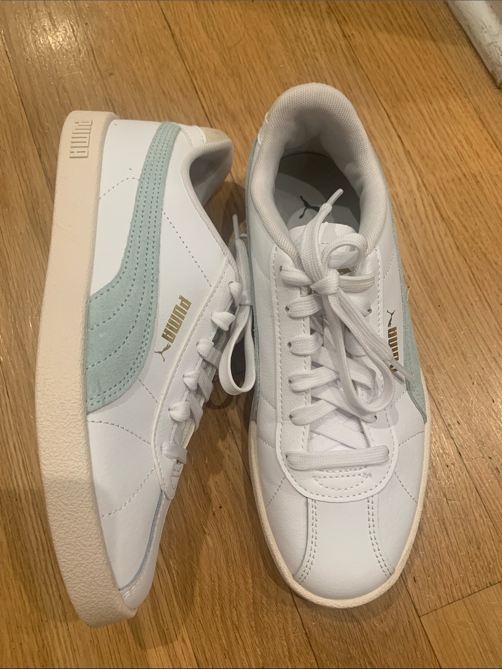 Puma White Sneakers with Light Blue Accent